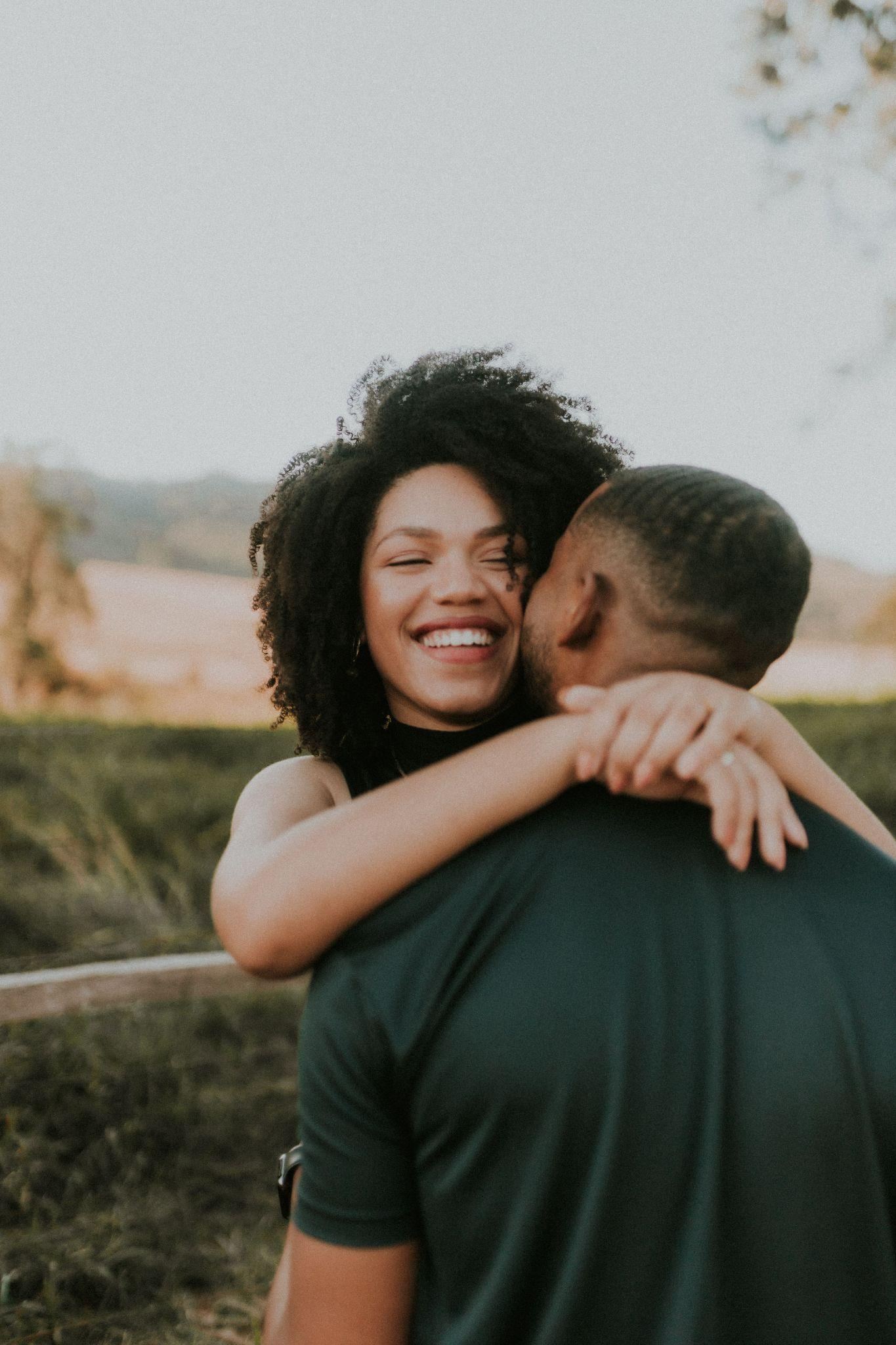 A laughing embrace in the open air