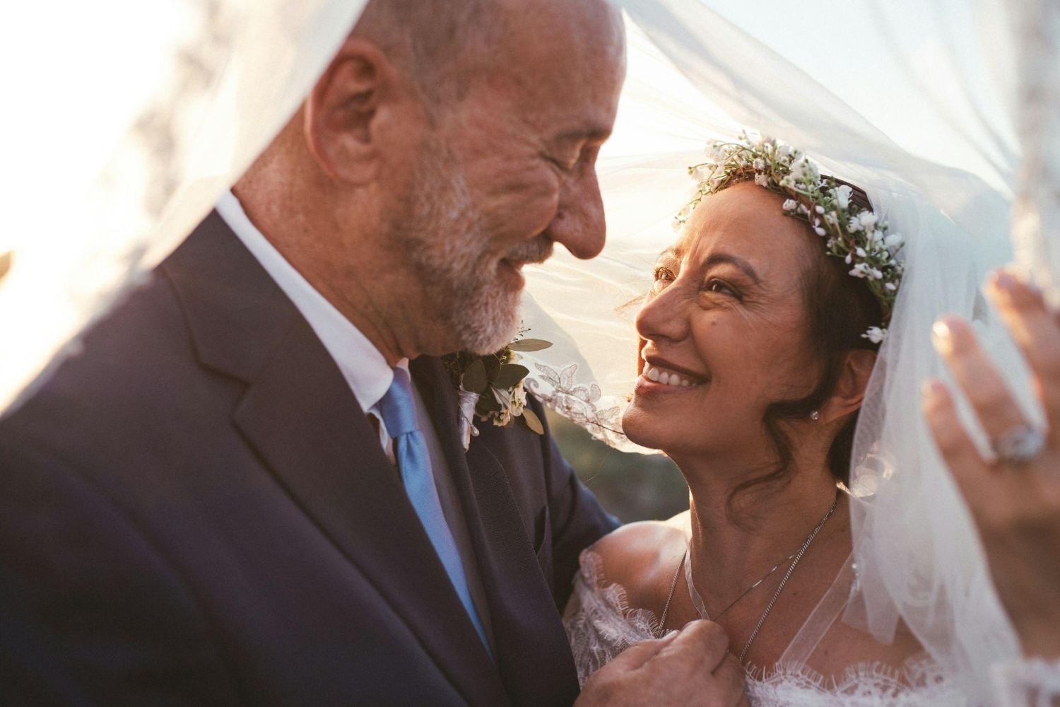 A bride and groom under the veil, later in life