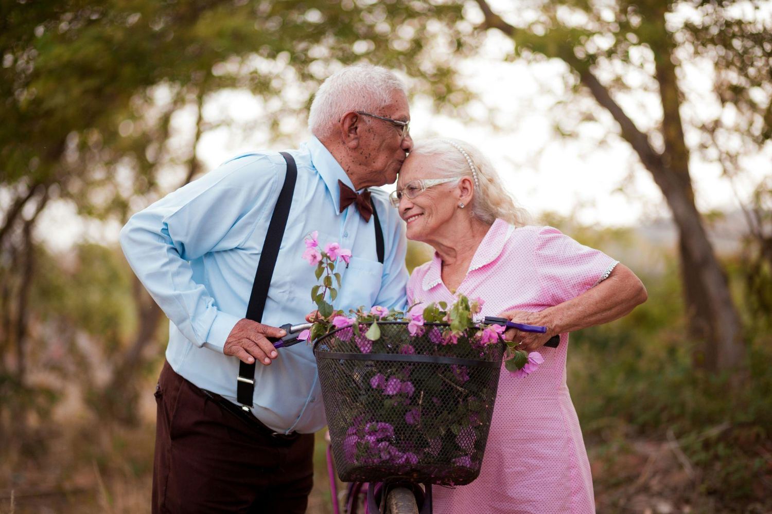 An older couple with a basket of flowers