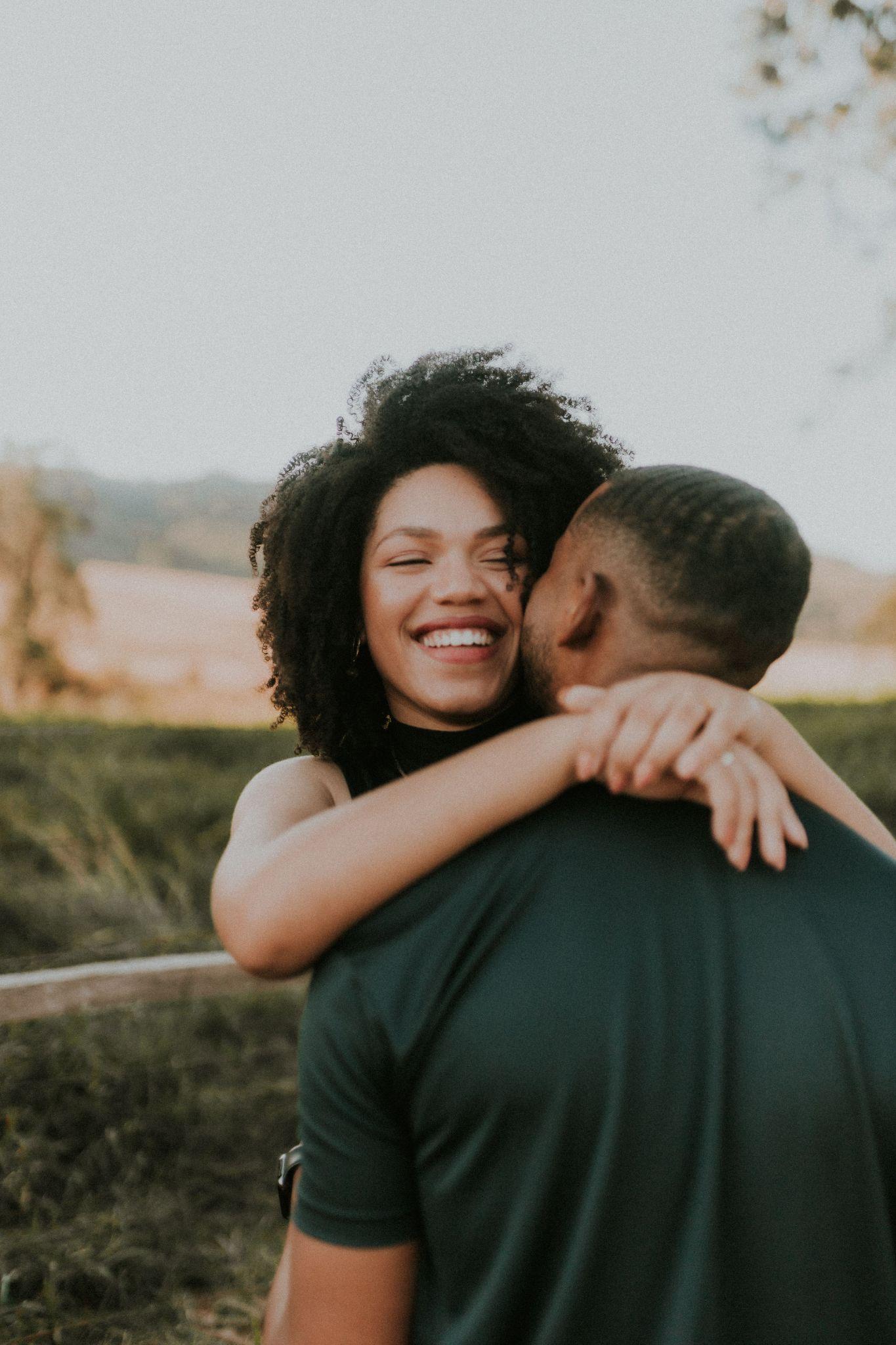 A laughing embrace in the open air