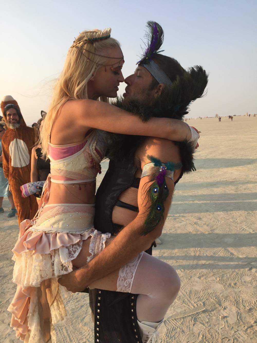 Holding each other at dusk